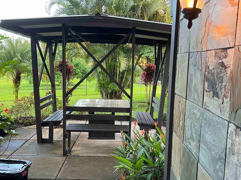 Downstairs lanai and covered table area for outdoor dining