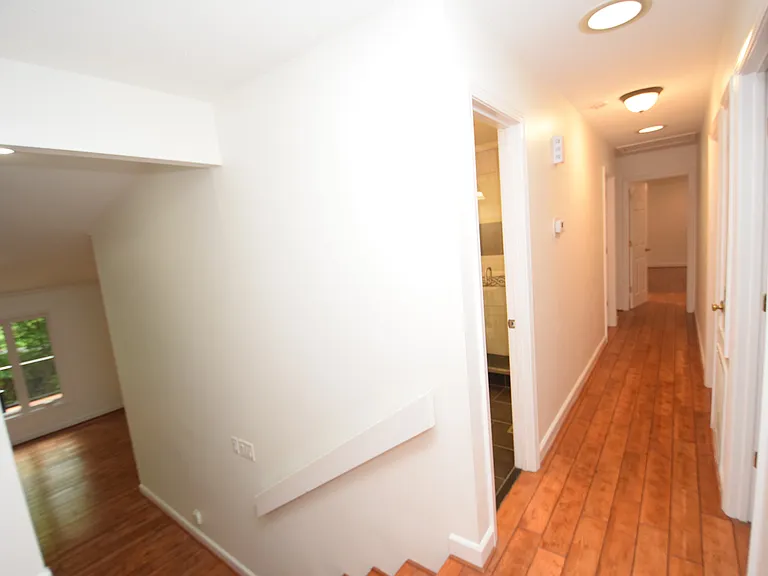 Main Level Hallway to 3 bedrooms and Full Hallway Bathroom. Short stairs down to main living area.