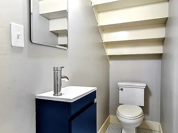 Downstairs half bath, right off the living room