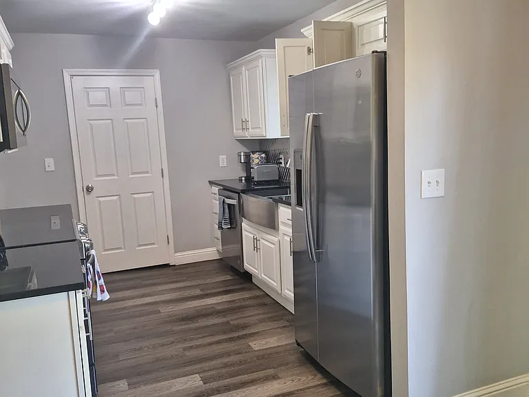 Kitchen with stove, refrigerator, dishwasher, and microwave oven.