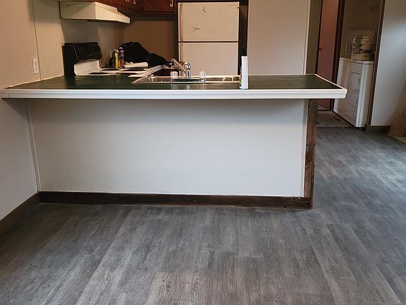 Living Room/Kitchen bar New plank floors throughout