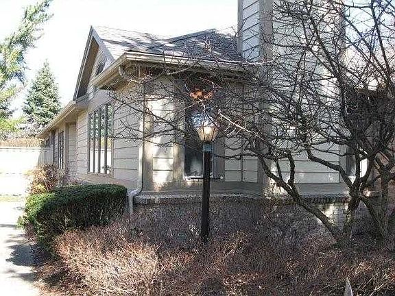 corner of front along the side walk to front door