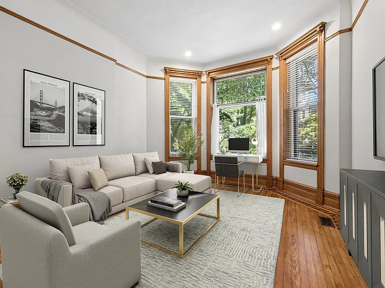 Restored classic Chicago greystone interior wood finishes with modern furnishing updates throughout the unit.