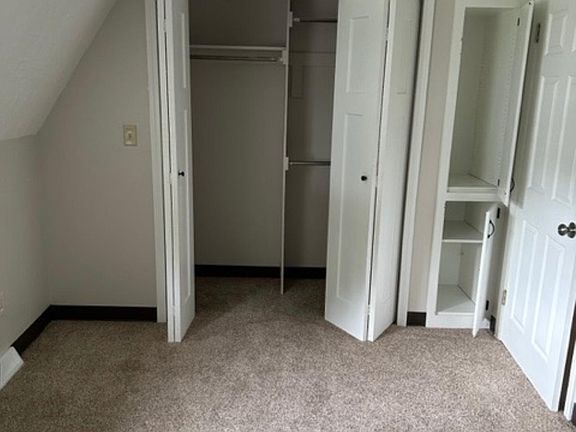 Master bedroom with closet and storage cabinet