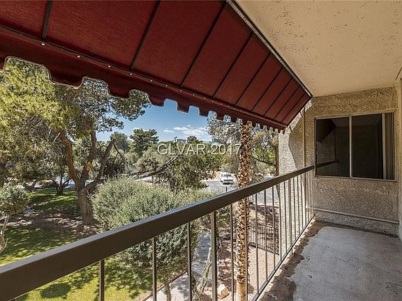 View from the living area into the courtyard area with its adjacent guest parking area.