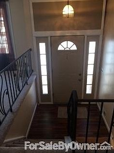 front door : Foyer from upper landing, new hardwood floor