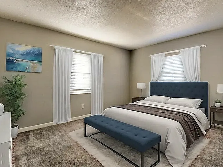Experience comfort and style in this beautifully designed bedroom.
