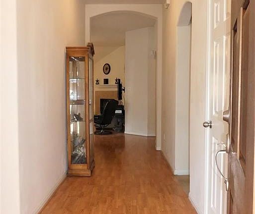 Welcome!  Easy maintenance floors run throughout the hallway, formal dining room and living room.