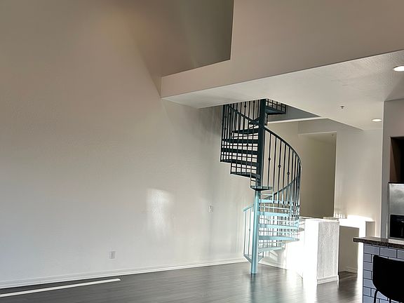 Living room and stairs to loft.