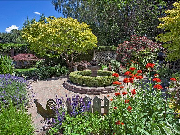 Beautiful central water feature is surrounded by park- like setting.