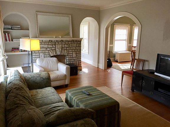 Living room with view to dining area and sunroom