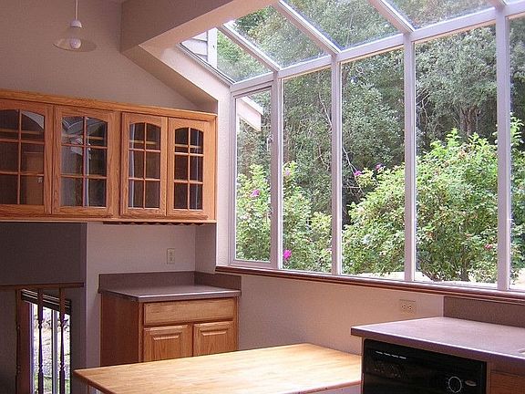 Large kitchen with atrium windows.