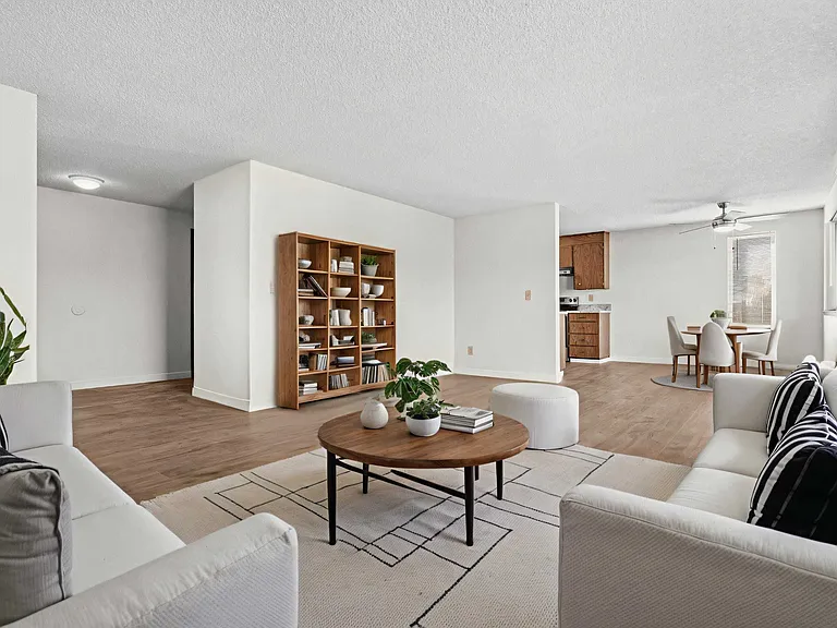 Bright and inviting living room with large windows and natural light Bright and inviting living room with large windows and natural light