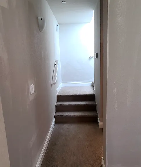Downstairs hallway. The half bath is on the right side.
PLEASE NOTE: The two-tone paint is fixed and does not look like that.
