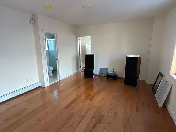 Living room leads to one of the bathrooms and one of the bedrooms.
