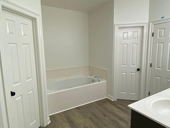 Primary bath with soaking tub, separate walk in shower.