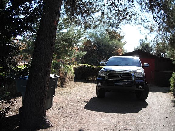 Driveway with garage behind