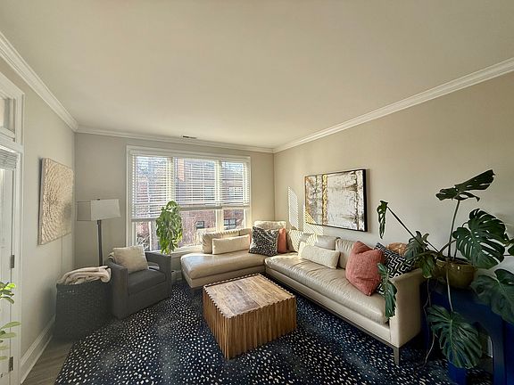 Bright and airy living room with working fireplace