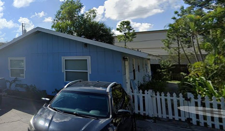 It is the front unit of the blue duplex. There is a small fenced in yard shared with the other tenant. Off street parking.