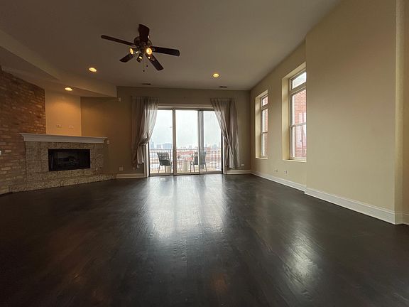 Living room. Ceiling fan and gas fire place