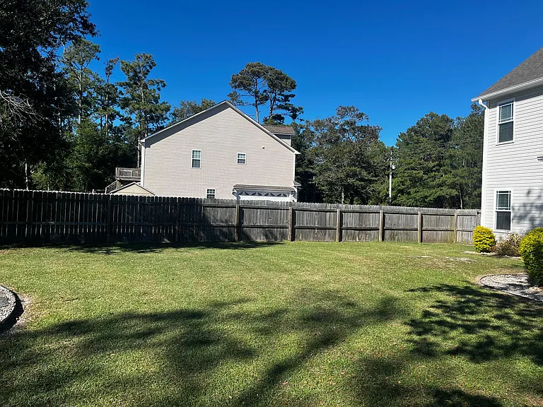 Large, fully fenced backyard with plenty of room for outdoor activities.