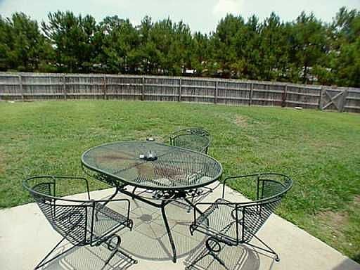 Older view of backyard