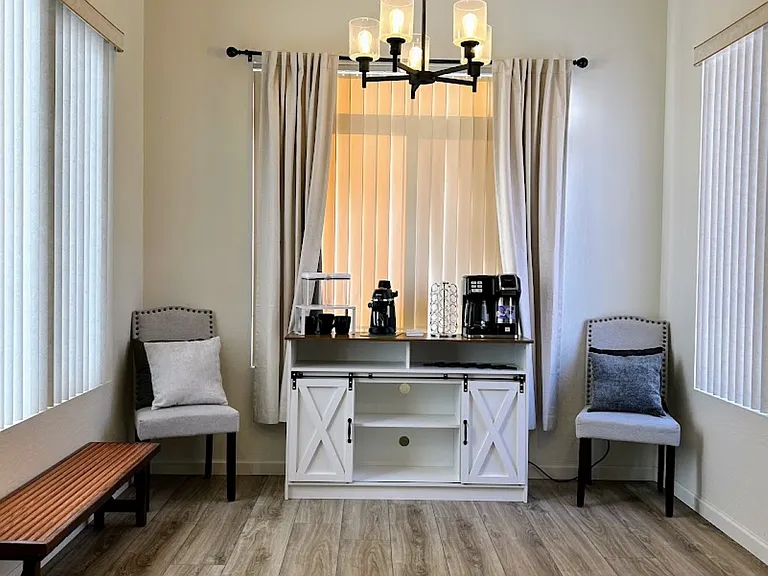 Coffee station equipped with coffee maker with option for pods or carafe, and mini-espresso machine. Updated light fixtures.