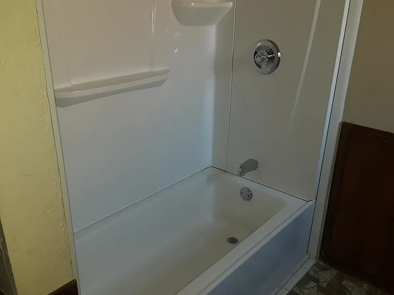 Front bathroom...tub with shower