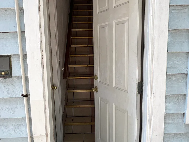 Private entryway to the one-bedroom upstairs unit