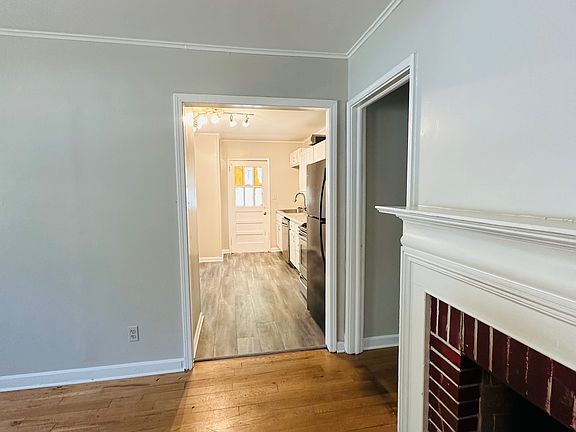 Bright family room with closet and kitchen views.