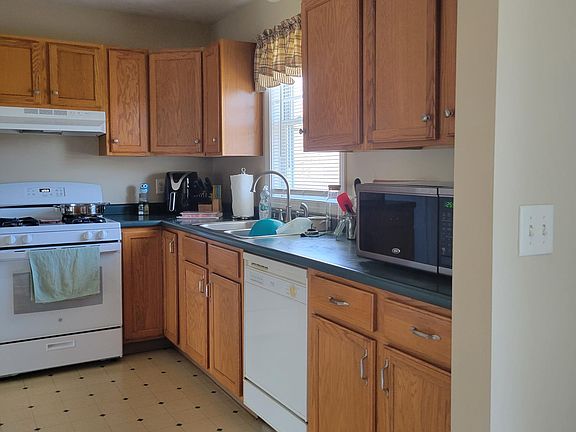 Gas stove and dishwasher in this bright kitchen