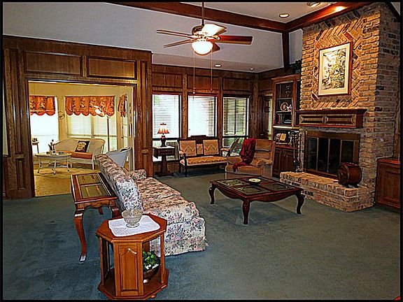 The large den can accommodate the biggest of gatherings with additional seating available in the adj