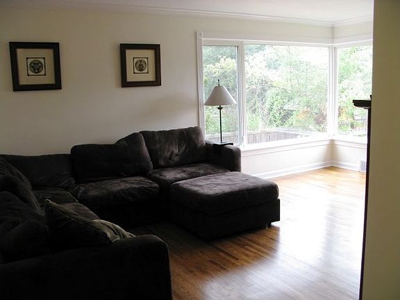 UPSTAIRS LIVING ROOM WITH DOUBLE BAY WINDOWS
