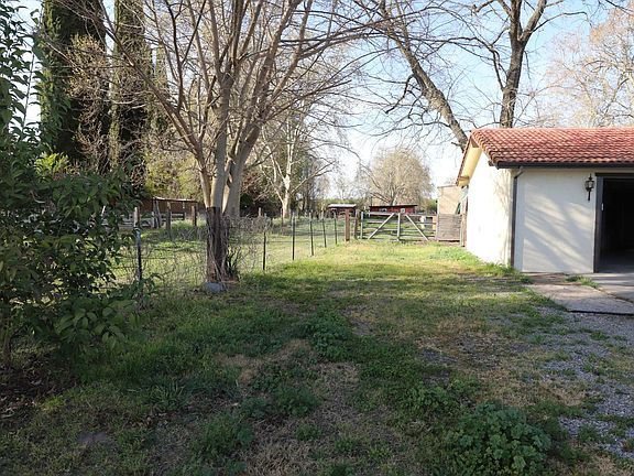 Left side of property. Along the garage is a RV spot with hook ups.