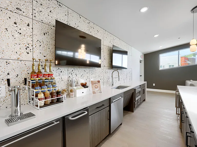 Your morning ritual, elevated. The Garrett Uptown resident coffee bar features a full syrup station, draft tap, and all the tools to craft your perfect cup _ complimentary for residents.