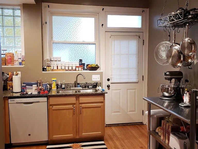 Kitchen attached to enclosed back patio
