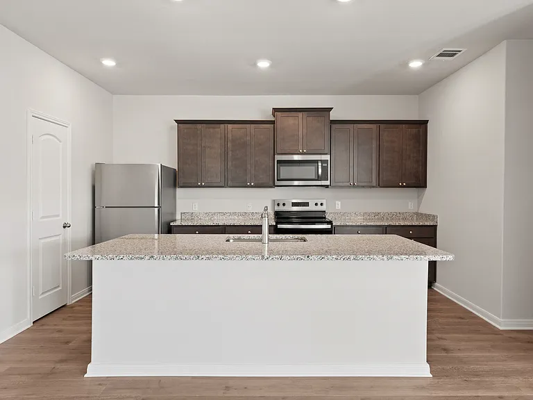 The kitchen has a beautiful kitchen island.