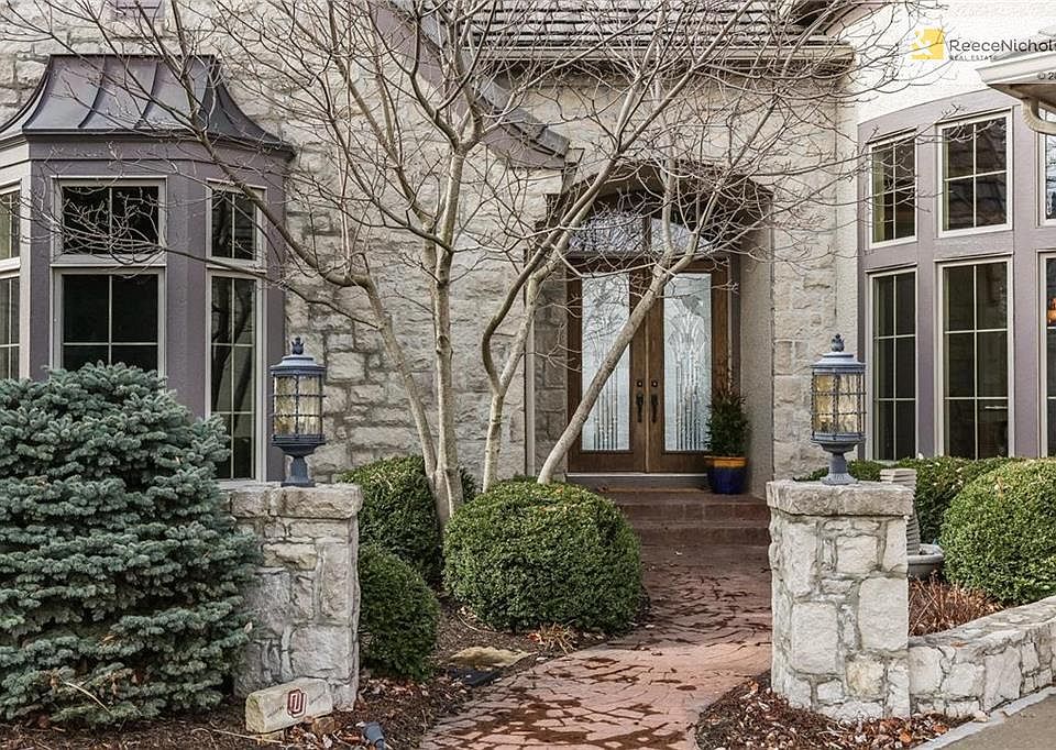 Lovely landscaping, double entry doors, stamped concrete pathway, stone pillars. Bay windows in dining room and in 2nd bedroom on main floor. Pretty entry to a beautiful home on a stellar lot.