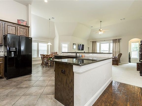 The open kitchen is designed with family living in mind to provide easy entertaining or family enjoyment.