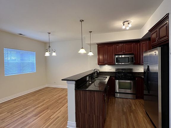 2nd image of 6112 W Diversey Ave Unit G-1