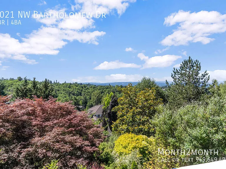 9021 NW Bartholomew Dr — Photo 35