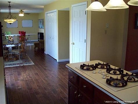 Efficient kitchen opens to the family room living space. New flooring thru-out. Single door leads to unfin basement. Double door is the laundry closet and storage.
