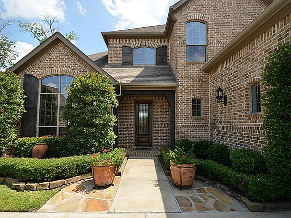 Beautiful glass paned door greets at he entrance.
