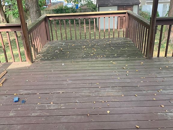 Covered deck with storage shed