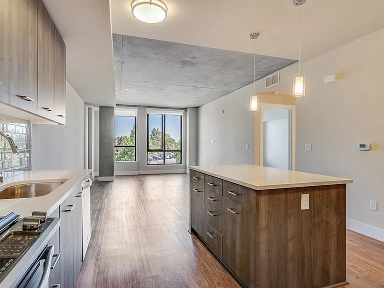 Wood-like flooring throughout living areas in select apartment homes