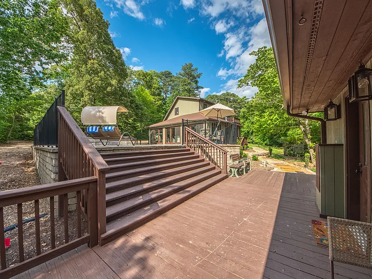 Wrap around deck and pool house.