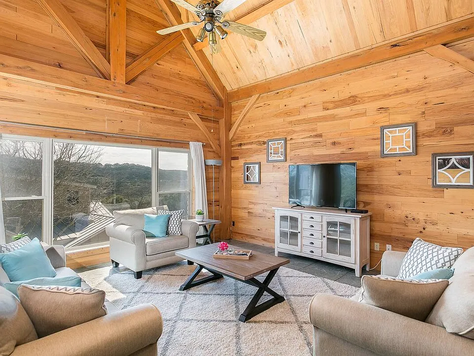 Living room has a pullout sleeper sofa and love seats.
