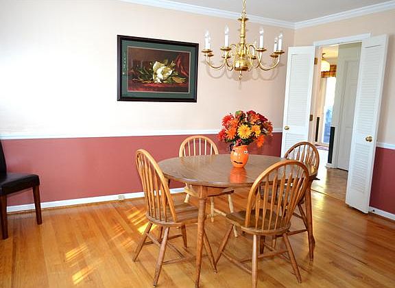 Dining room has crown molding & chair rail trim