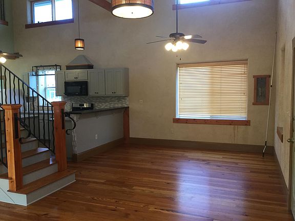 Front entry, dining, kitchen, staircase.