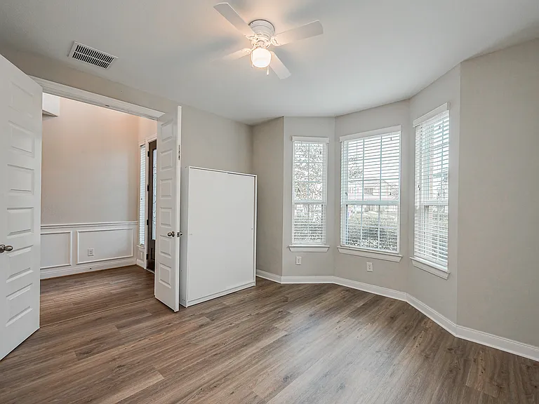 2 additional bedrooms DOWNstairs and this one with beautiful bay windows